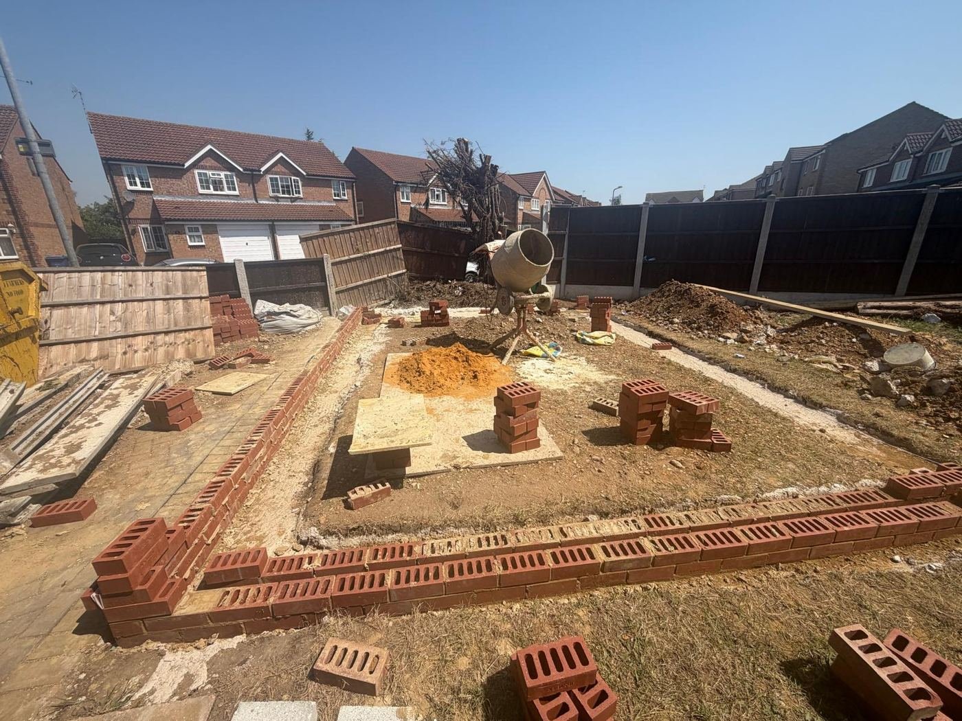 Outbuilding foundations and first brick courses