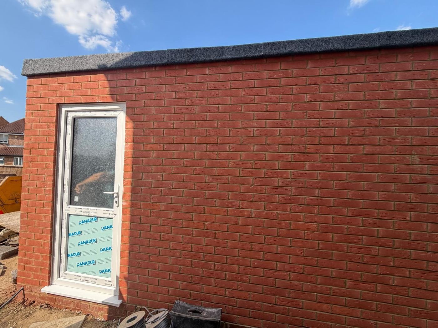 uPVC door fitted with capping stones on parapet